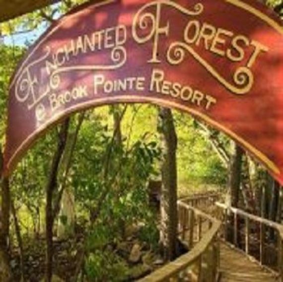 Trees with an archway displaying "Enchanted Forest" at Brook Pointe Resort Syracuse Indiana