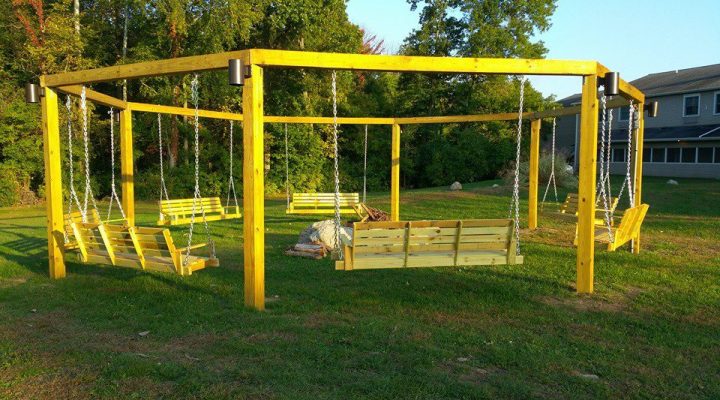 Wooden swing seating in the garden at Brook Pointe Resort Syracuse Indiana