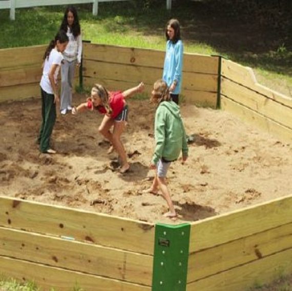 Outdoor gaga ball pit yard game area at Brook Pointe Resort Family Cove in Syracuse, Indiana