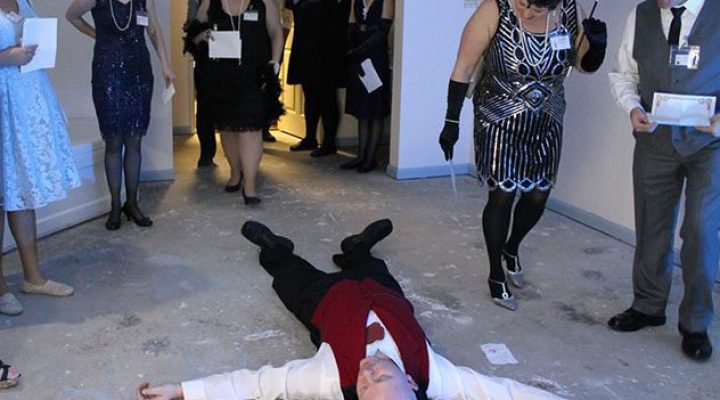 Guests participating in murder mystery activities at Brook Pointe Resort